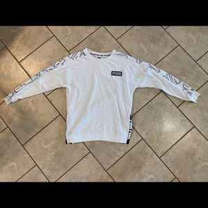 Pink sweatshirt with pink logo on sleeve